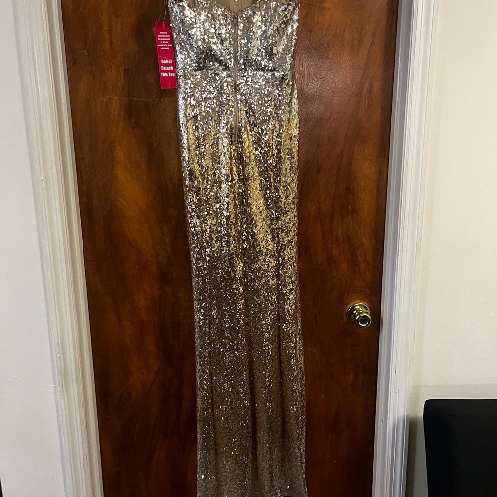 New with tags, worn once—gold sparkly dress, size 5, in excellent condition.